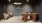 a room with a table chairs and a wall with a sign on it