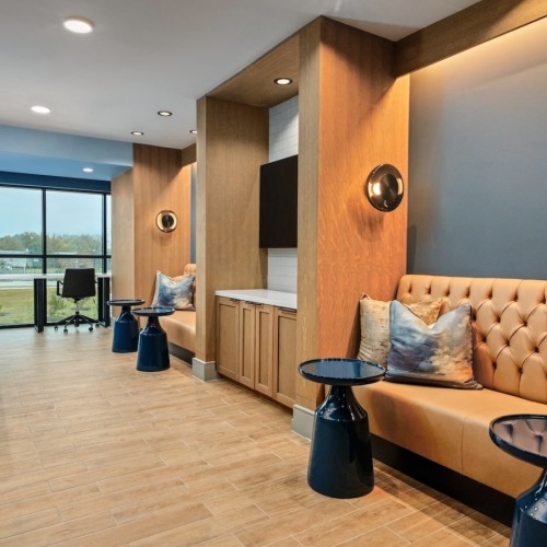 a room with a game table and seating 