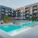 a swimming pool in a courtyard between buildings