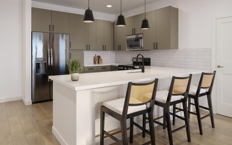 a kitchen with an island and chairs