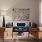 a living room with a blue couch and chairs