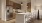 a kitchen with bar stools and a refrigerator